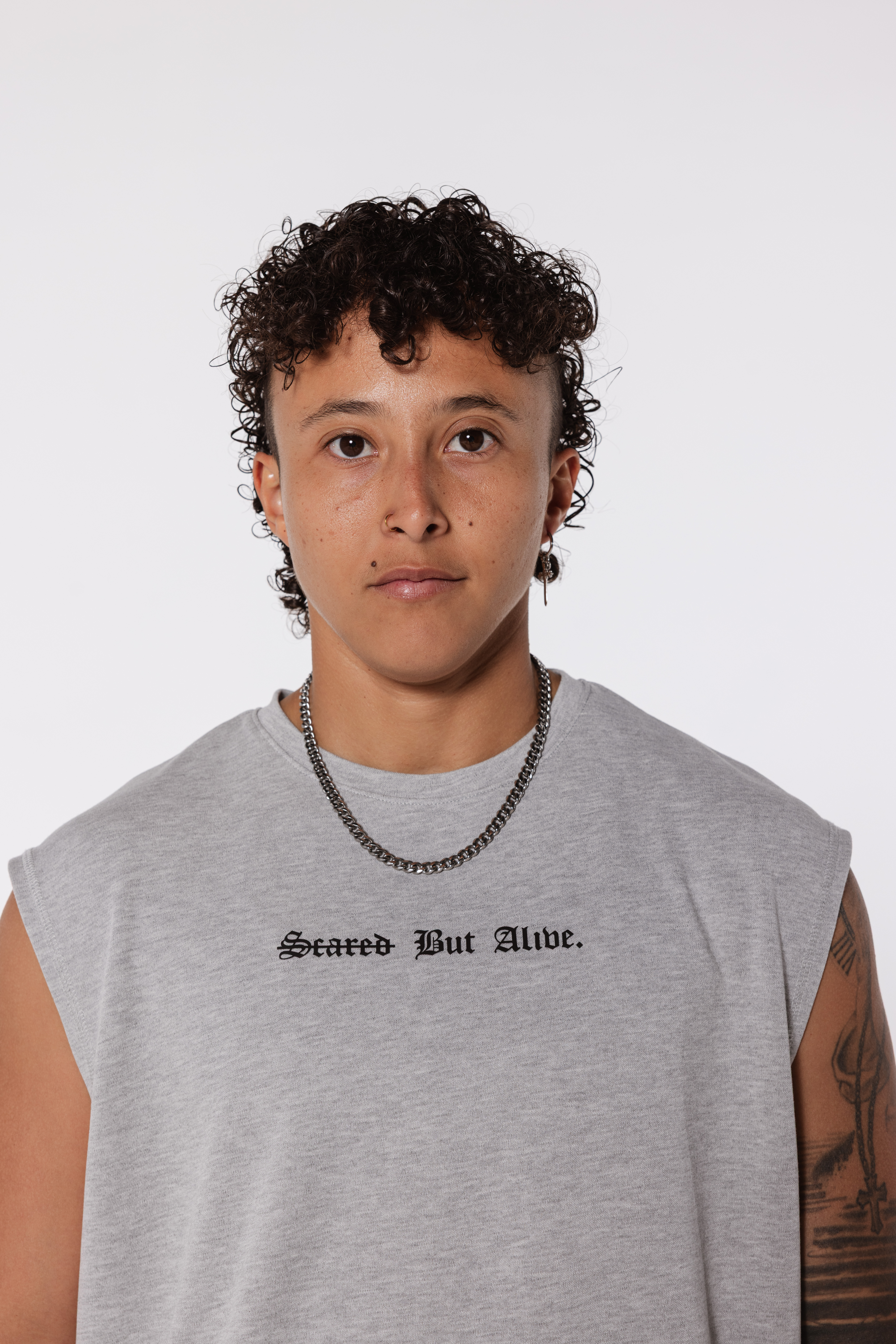 Gray tank neckline and armhole on-body fit detail